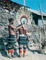 Theyieno (left) and Khony (right) dress and adorn themselves for the Sekrenyi-festival of the Angami Naga