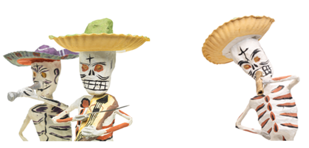 Das Foto zeigt drei Skelette, die Musik machen und Sombreros tragen