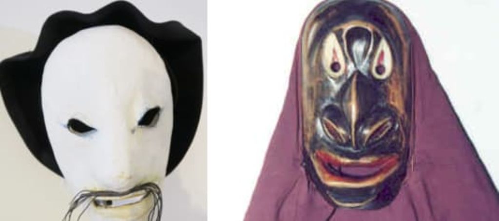 Zwei Masken: links eine weisse Maske mit Schnurrbart und einem schwarzen Beret, rechts eine dunkle Maske mit einem rötlichen Kopftuch
