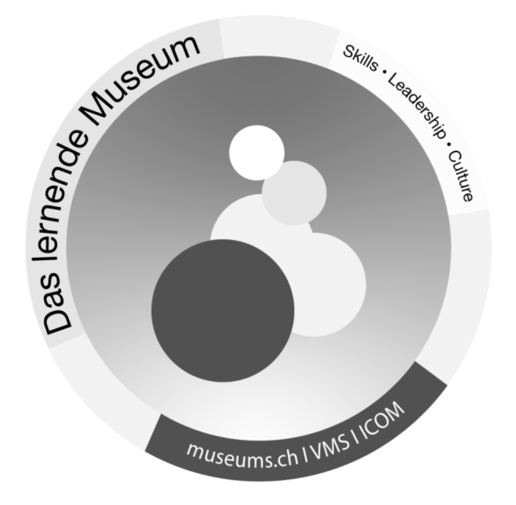 A gray circular emblem with white and dark circles displays the motto 